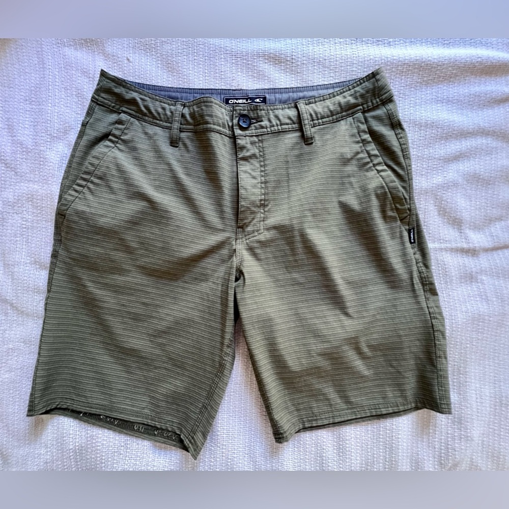 O’Neill hybrid shorts with zipper back pockets and drawstring.